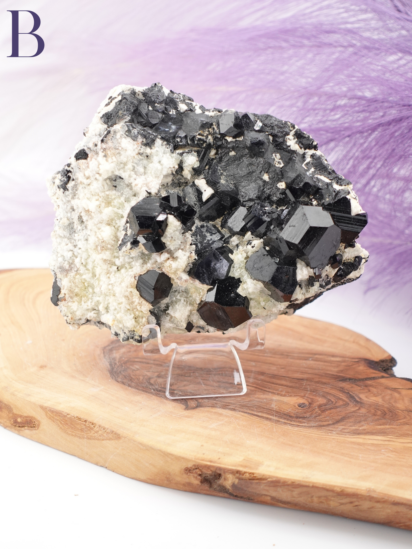 Option B black tourmaline, smoky quartz, and hyalite specimen on clear specimen stand.