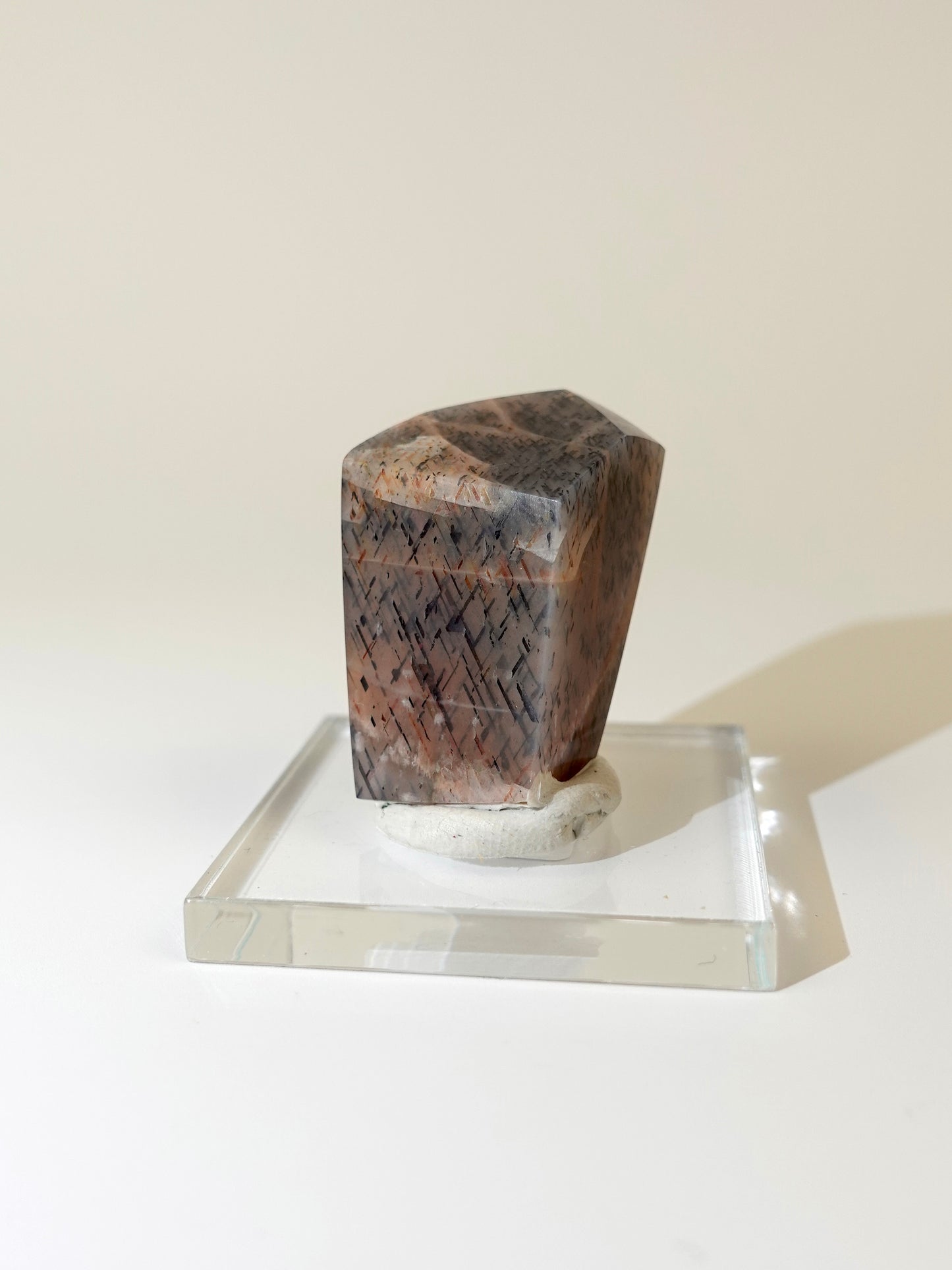 Lattice sunstone on stand on white background