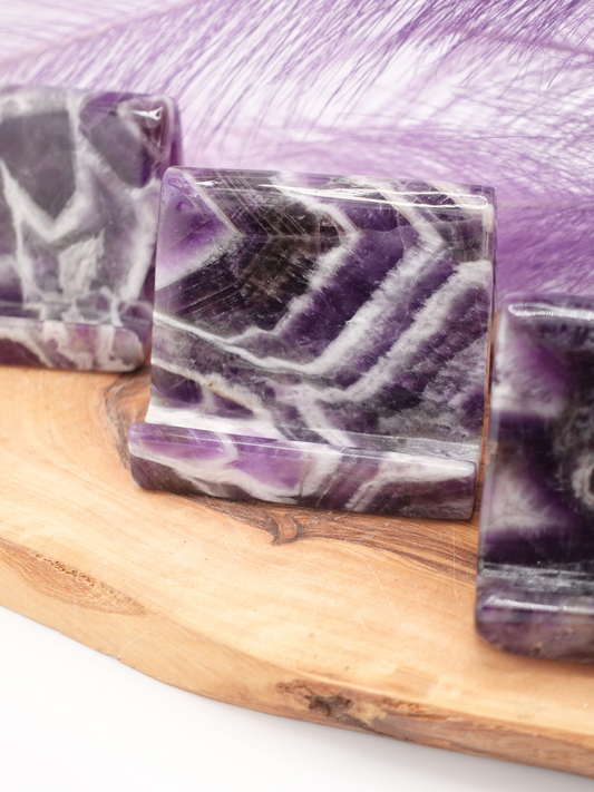 Three dream amethyst phone holders on wooden display stand