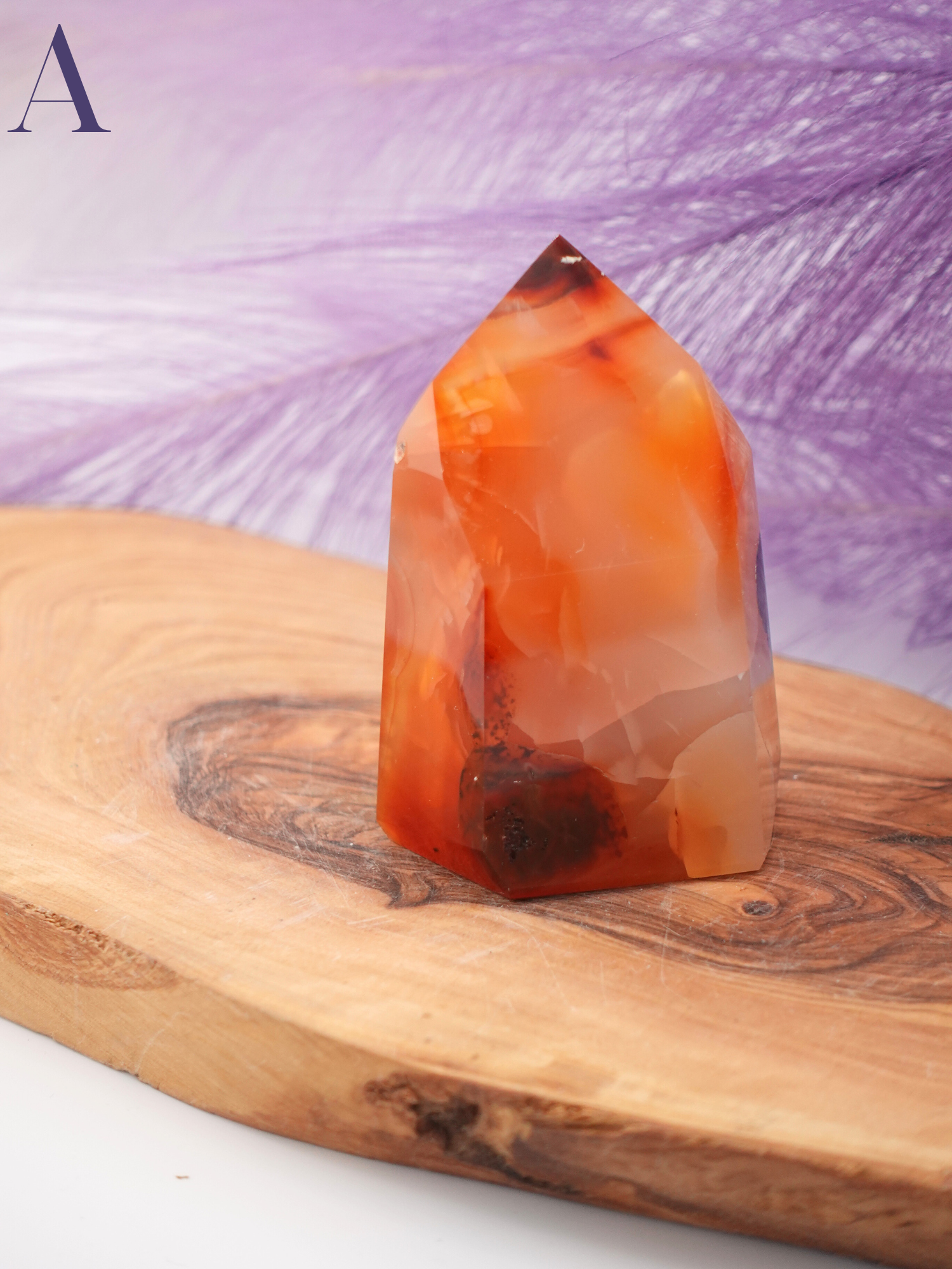Brazilian cut Carnelian tower option A on wooden display stand