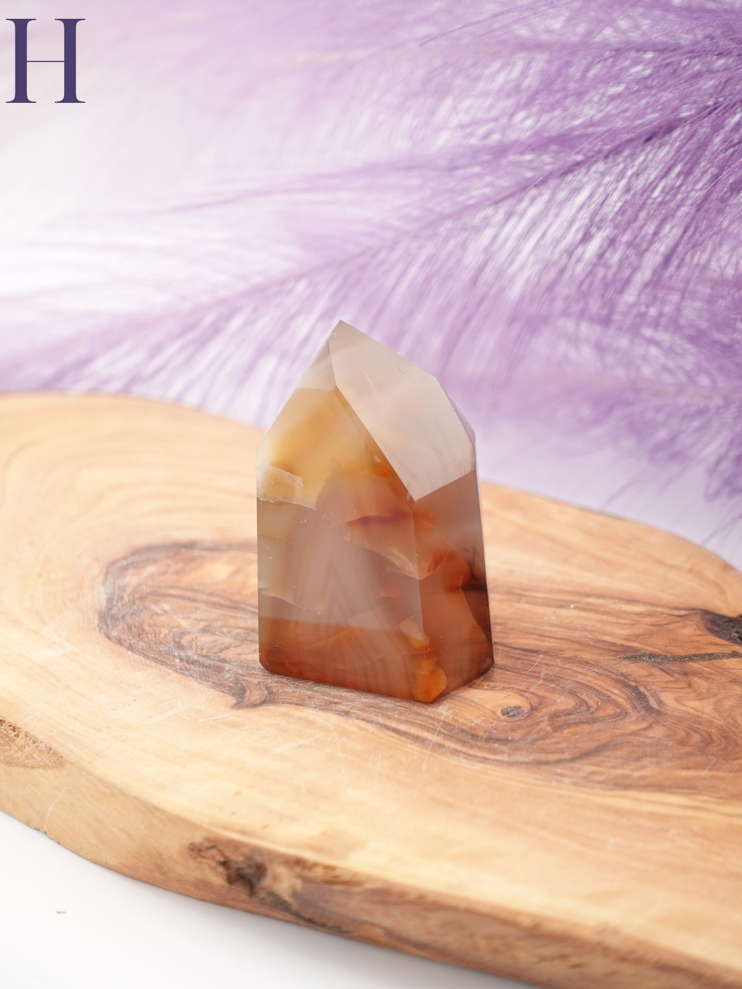 Brazilian cut Carnelian tower option H on wooden display stand