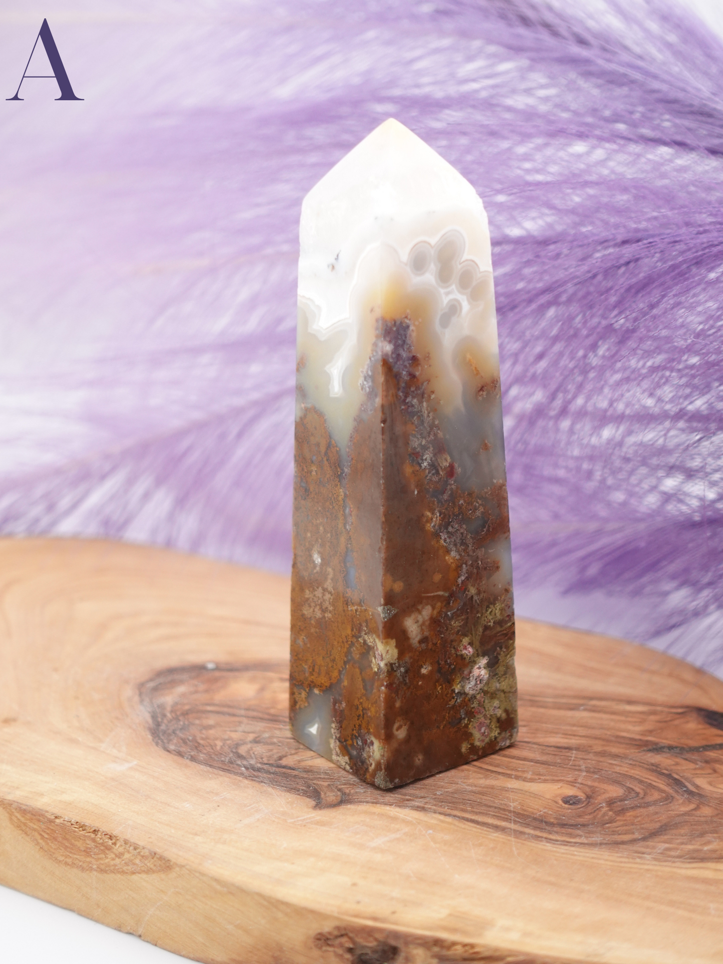 Scenic moss agate tower option A on wooden display stand