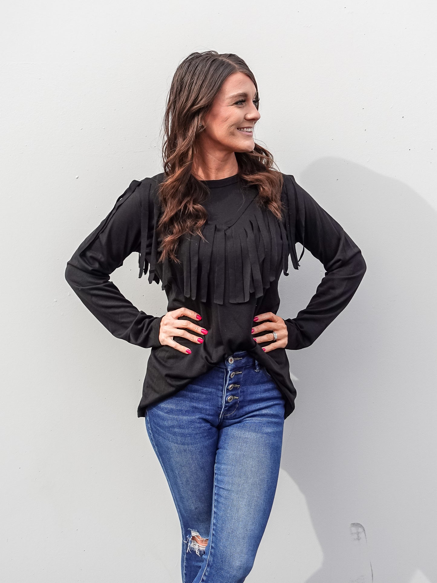 Black top with fridge details in the front in a V shape