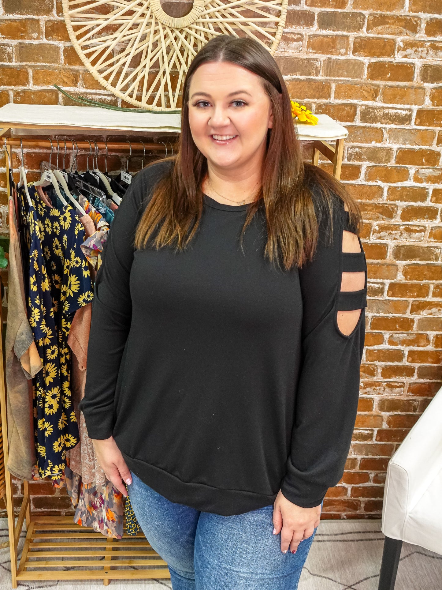Black long sleeve top with ladder detail cold shoulder.