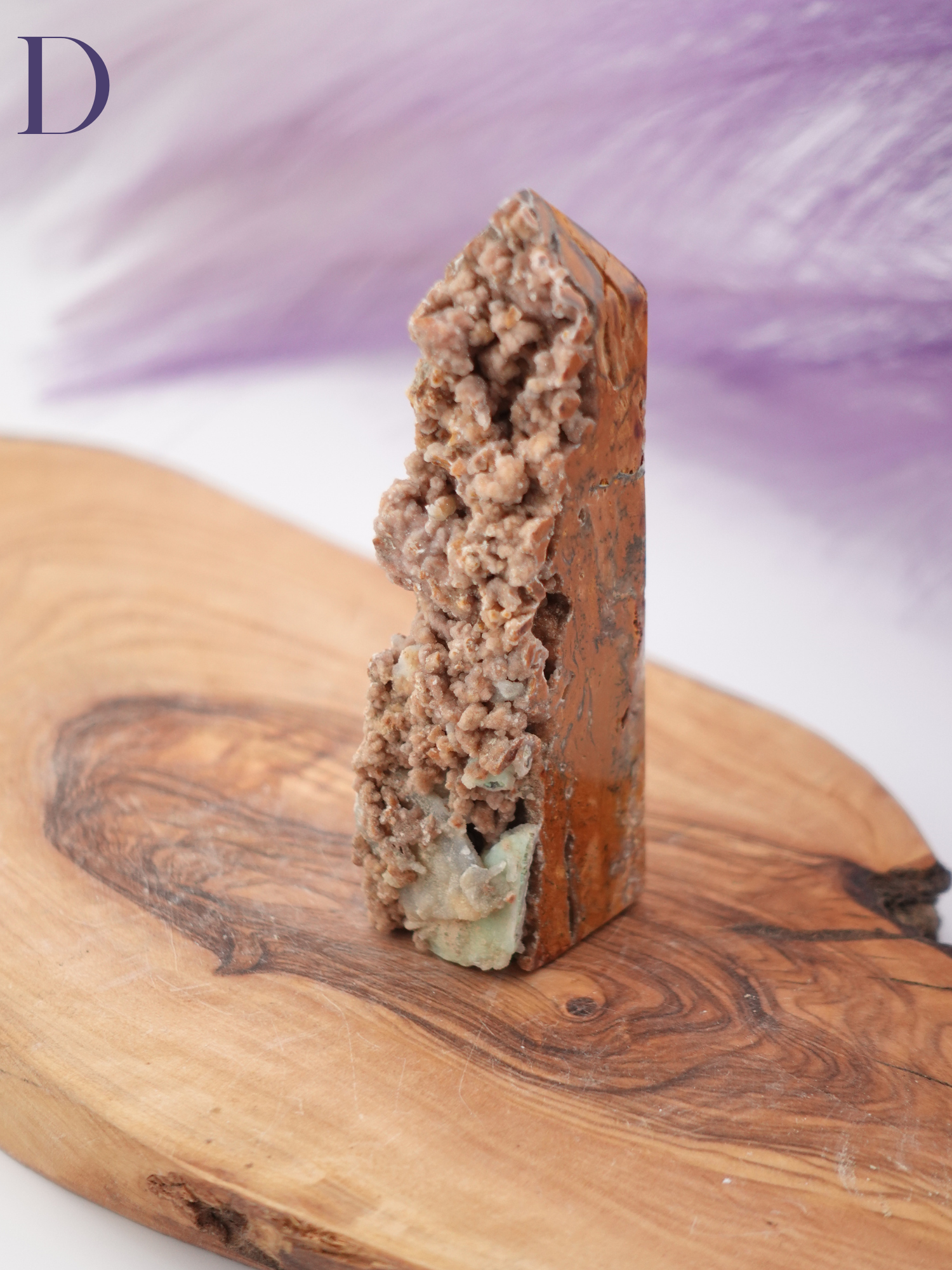 Display of Smithsonite tower option D on a wooden stand