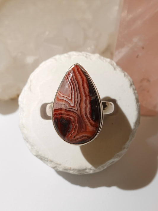 Mexican Crazy Lace ring on stand with pink crystal background