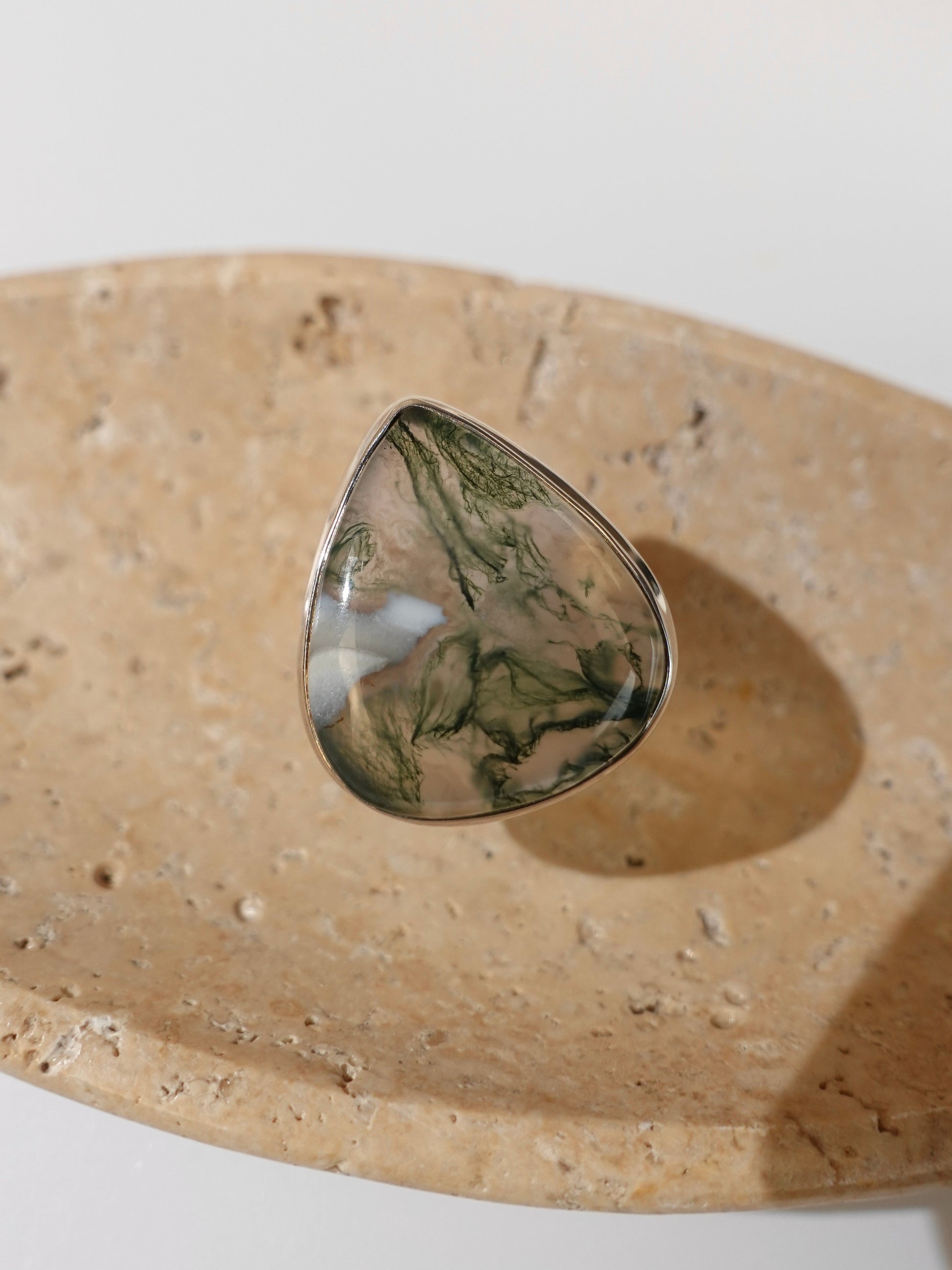 Moss Agate Ring on travertine display background