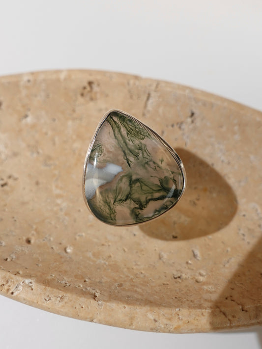 Moss Agate Ring on travertine display background