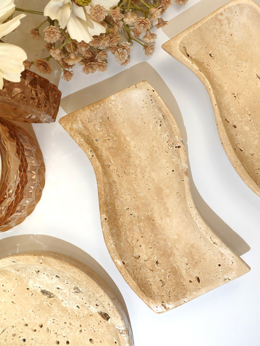 Collection of travertine dishes; highlighting the travertine wavy dish.