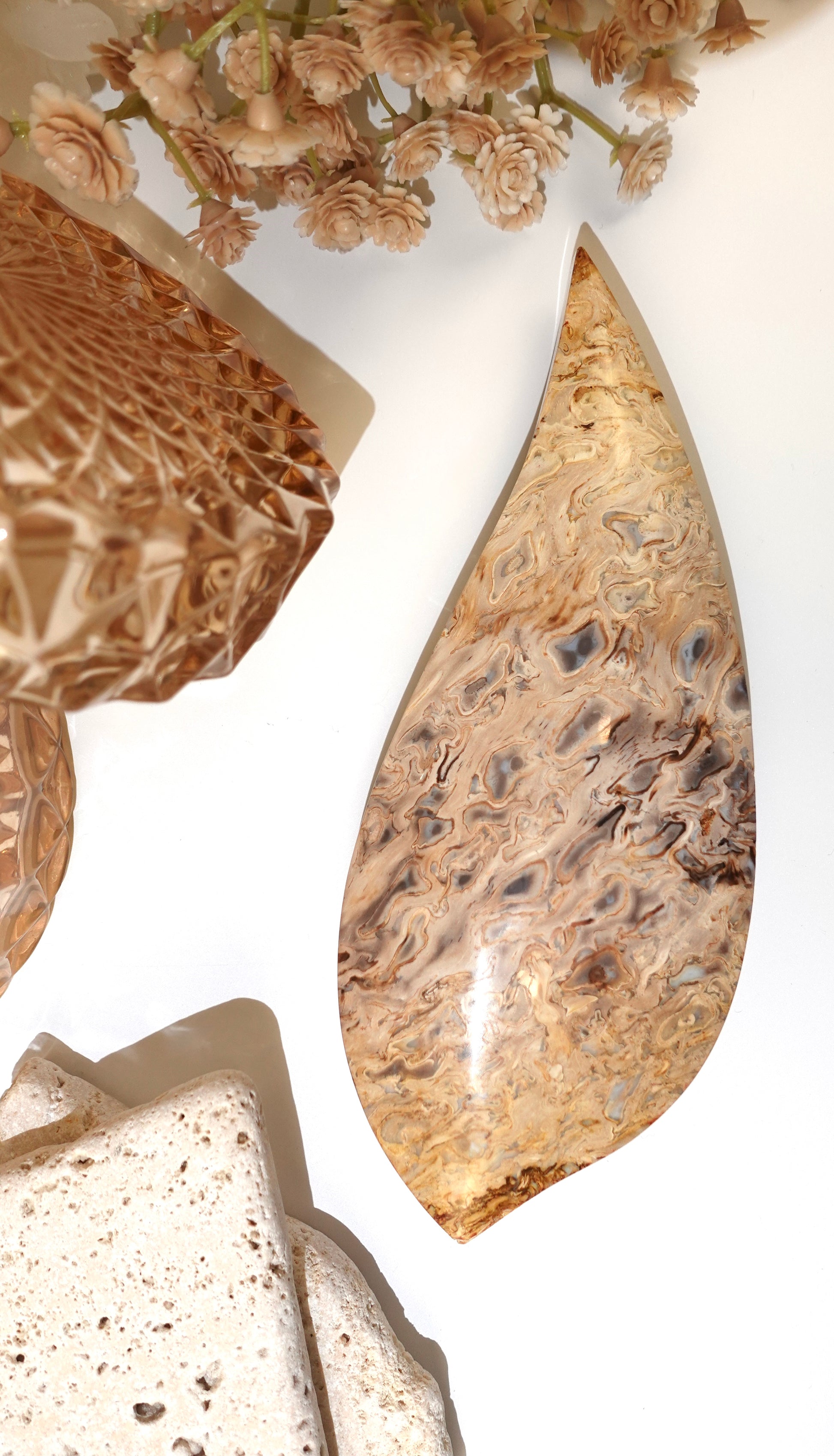 Palm root flame on white background with floral display items