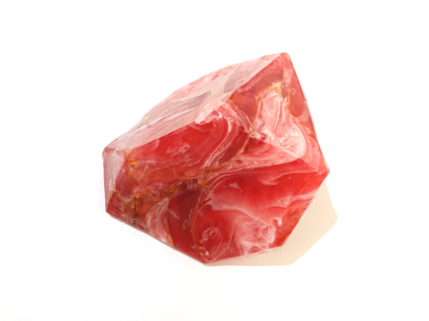 Red marbled soap bar on a white background