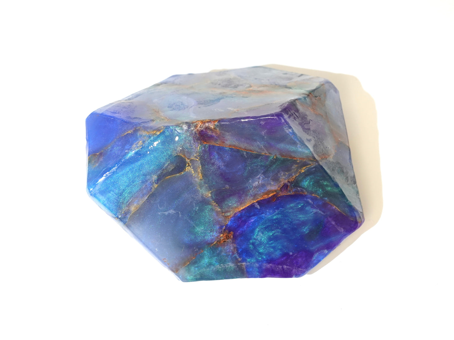 Purple and blue sparkly soap on white background