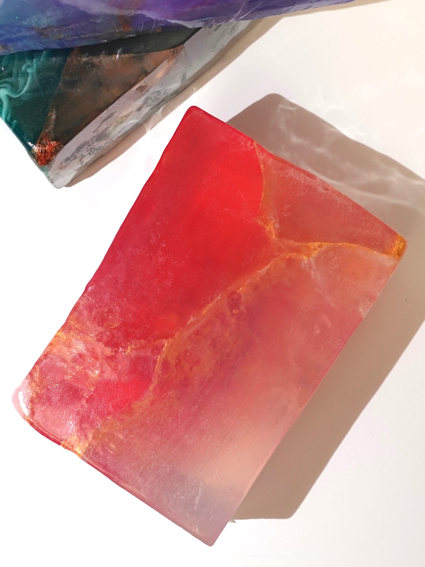 Red and orange stone on a white background