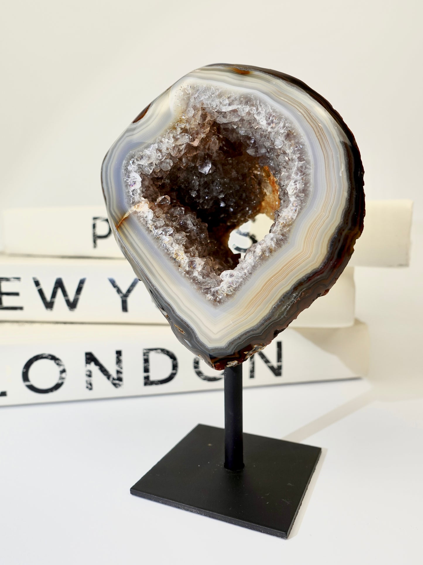 Geode on a stand with 'New York London' text in the background