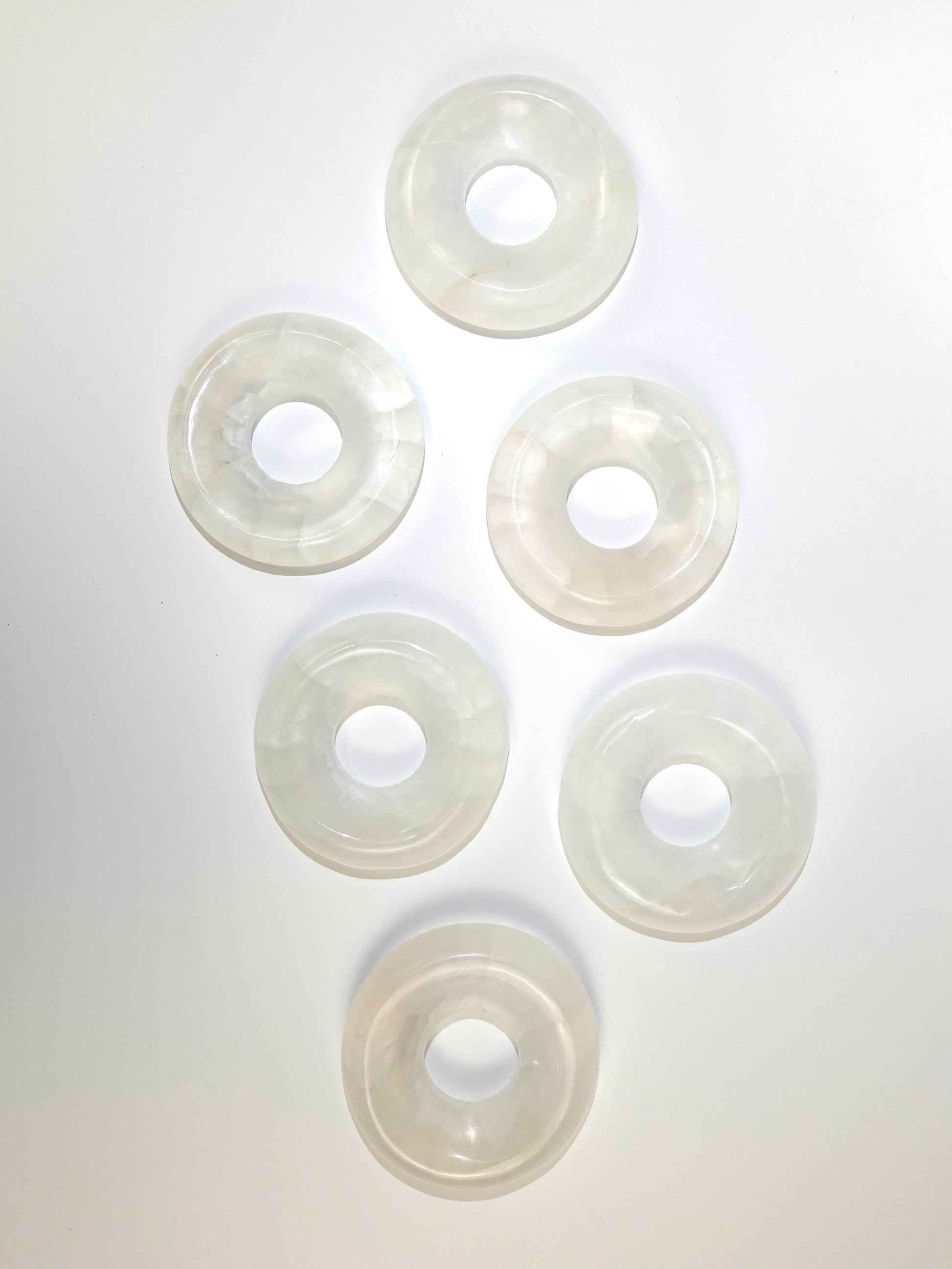 Selenite donuts on white background