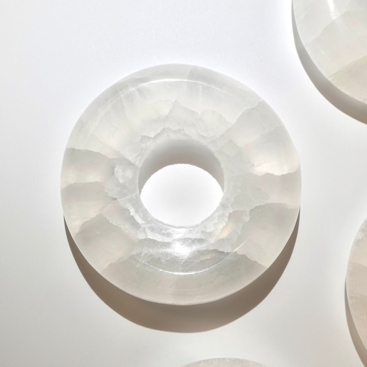 Selenite donut on white background