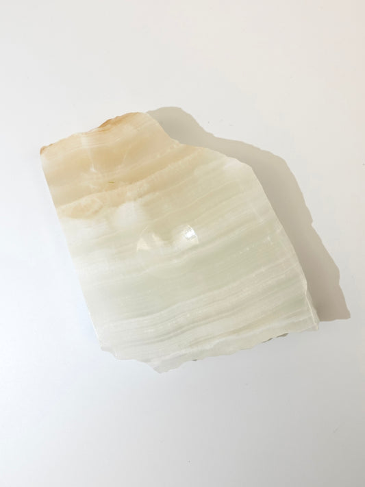 Banded Calcite Sphere Holder on white background A