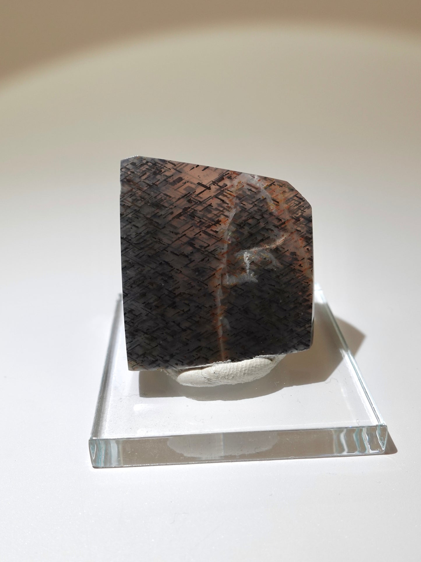 Lattice sunstone on stand on white background