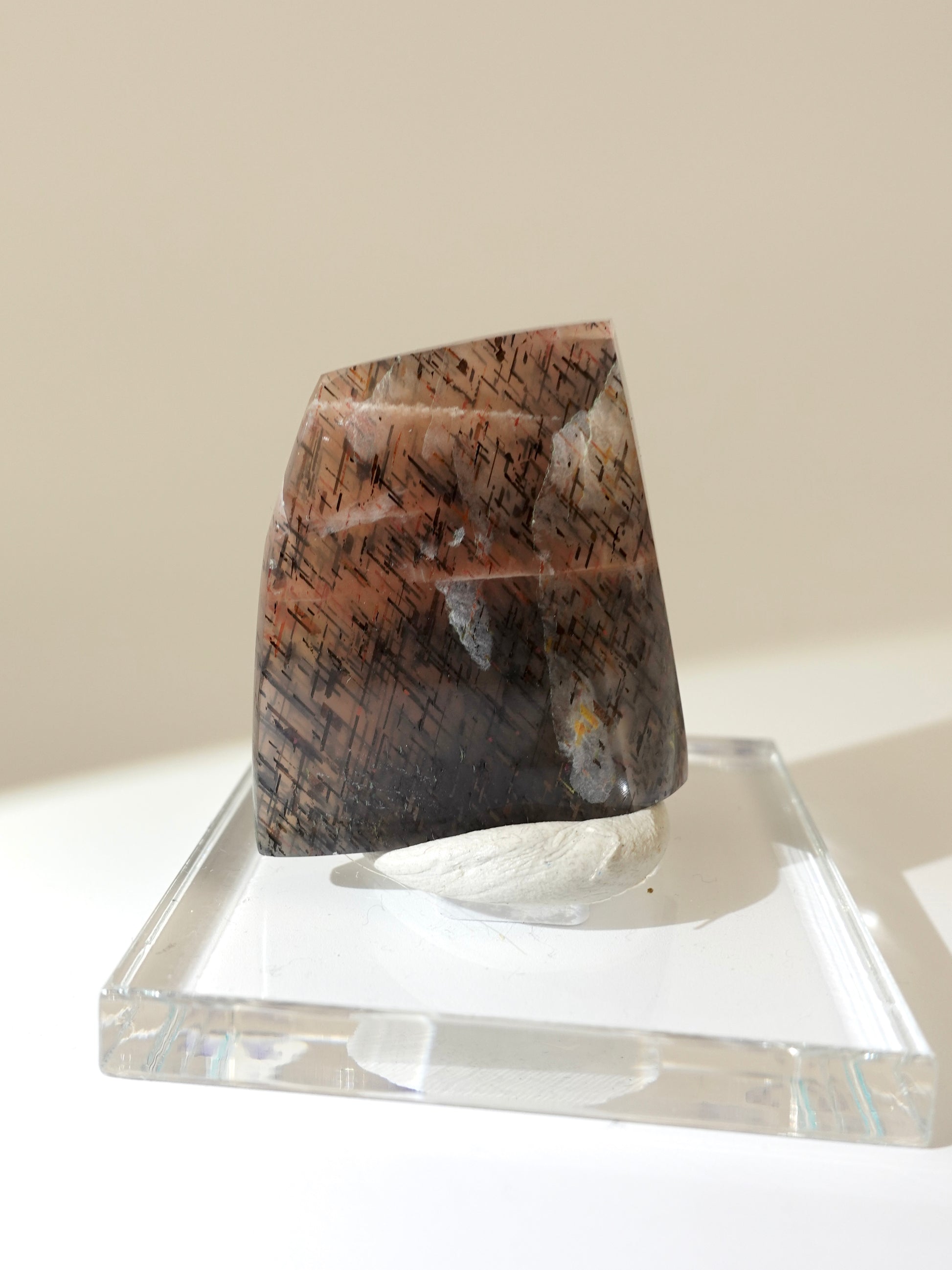 Lattice sunstone on stand on white background