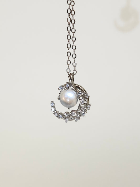 Moonstone moon necklace on White background