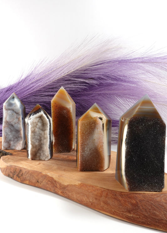 5 Druzy agate towers on a wooden display stand