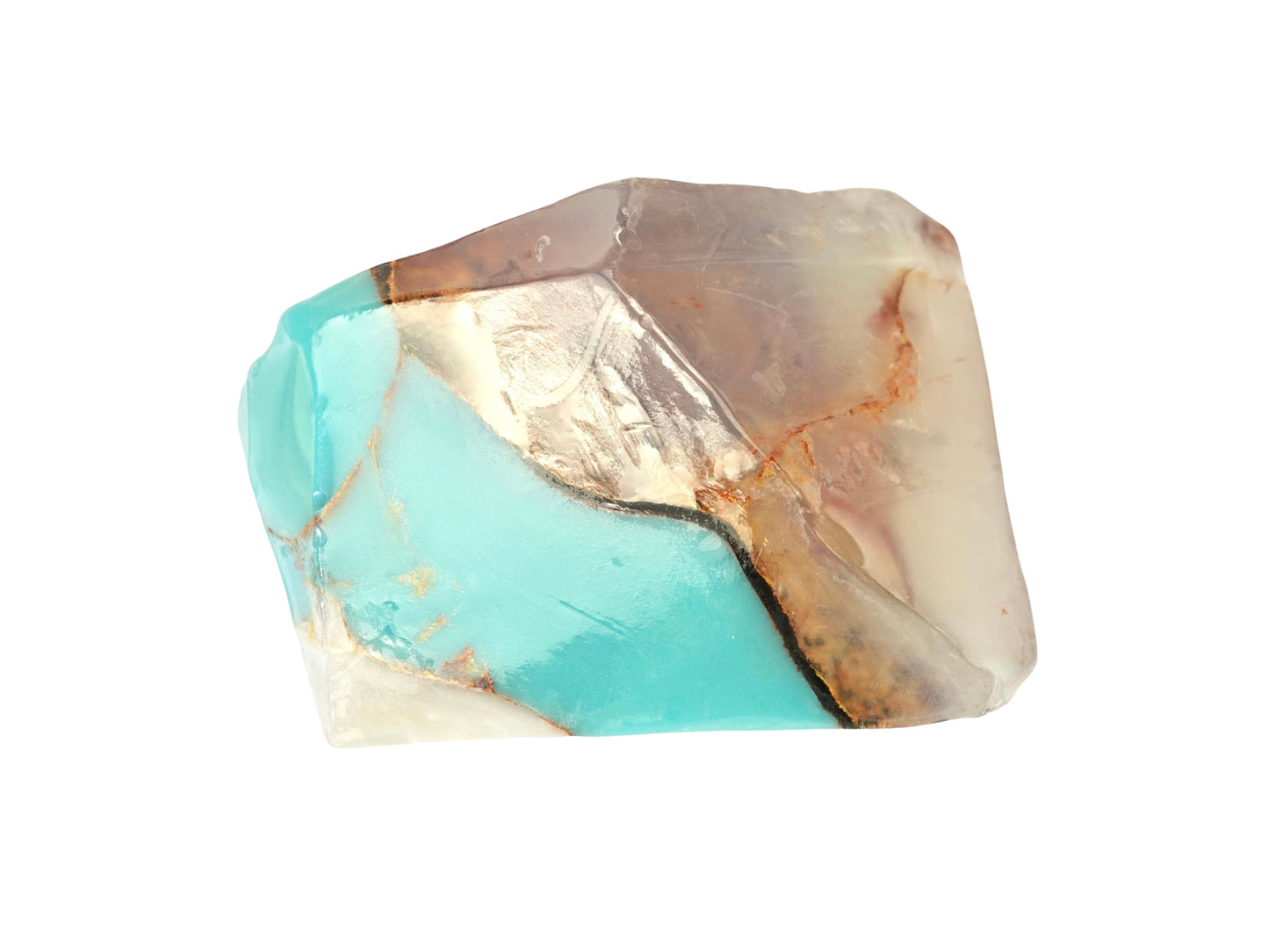 Crystal inspired soap with turquoise and gold coloration on a white background
