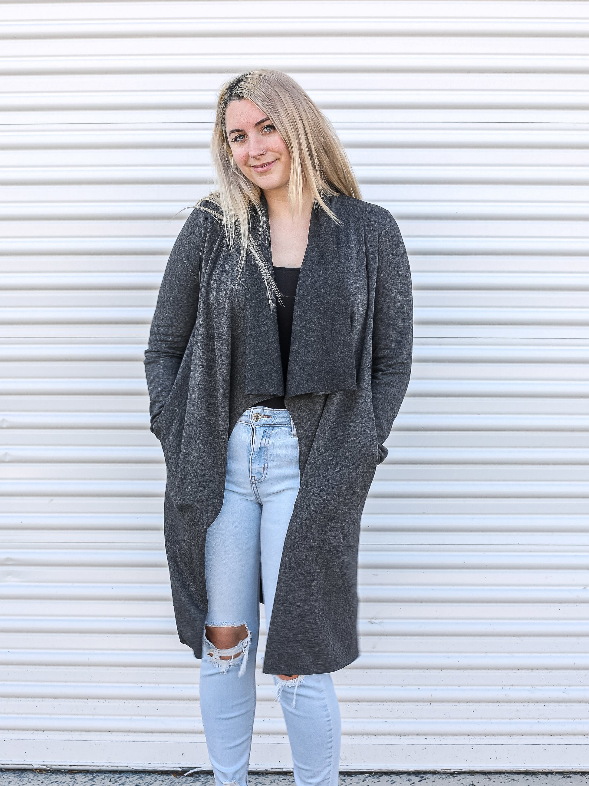 Long cardigan styled with light denim and a tank top
