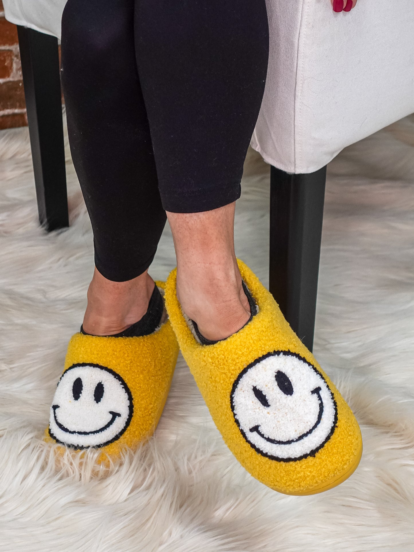 Yellow smily face slippers.
