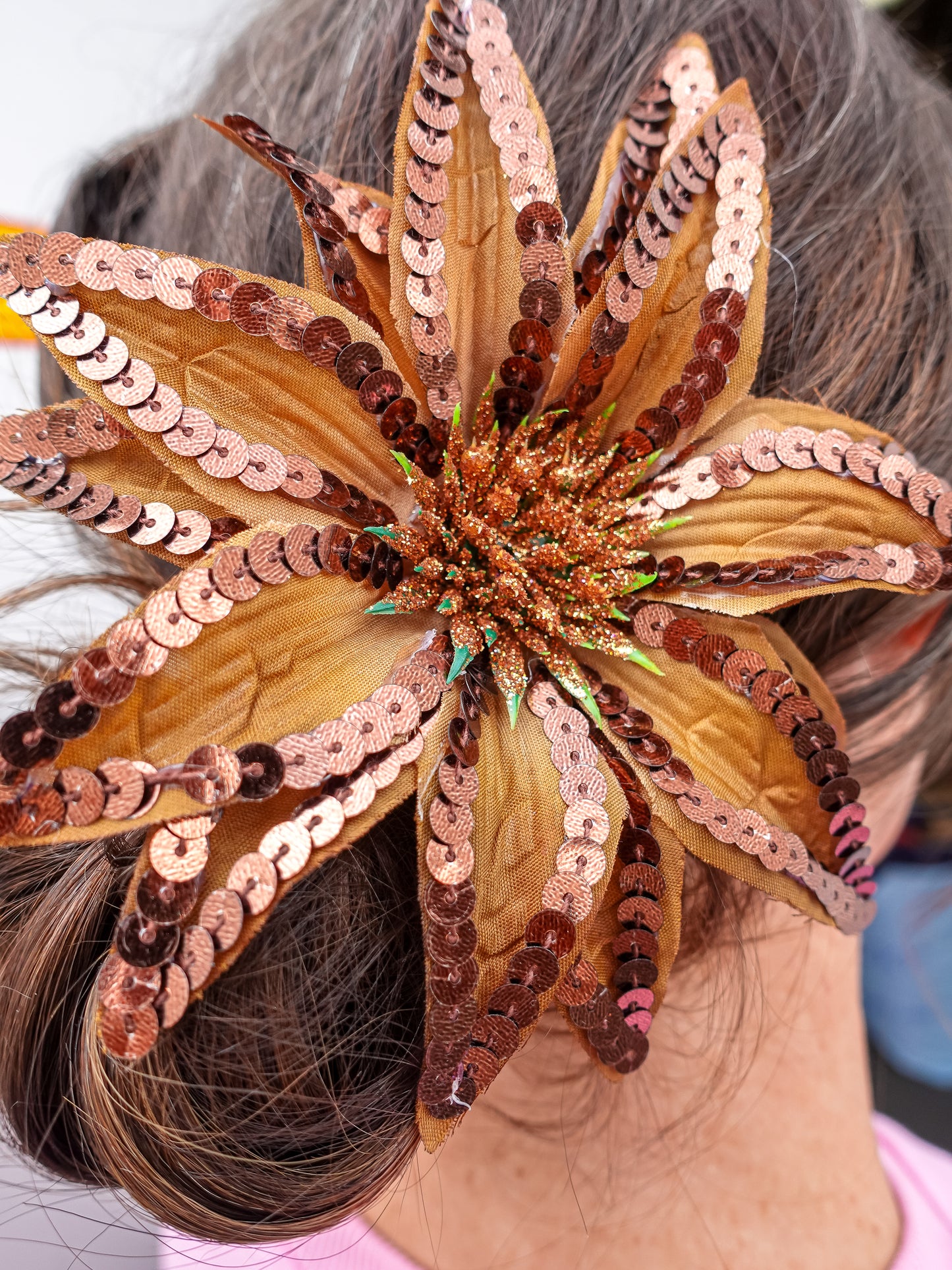 Toffee hair pin with glitter and sequin details.