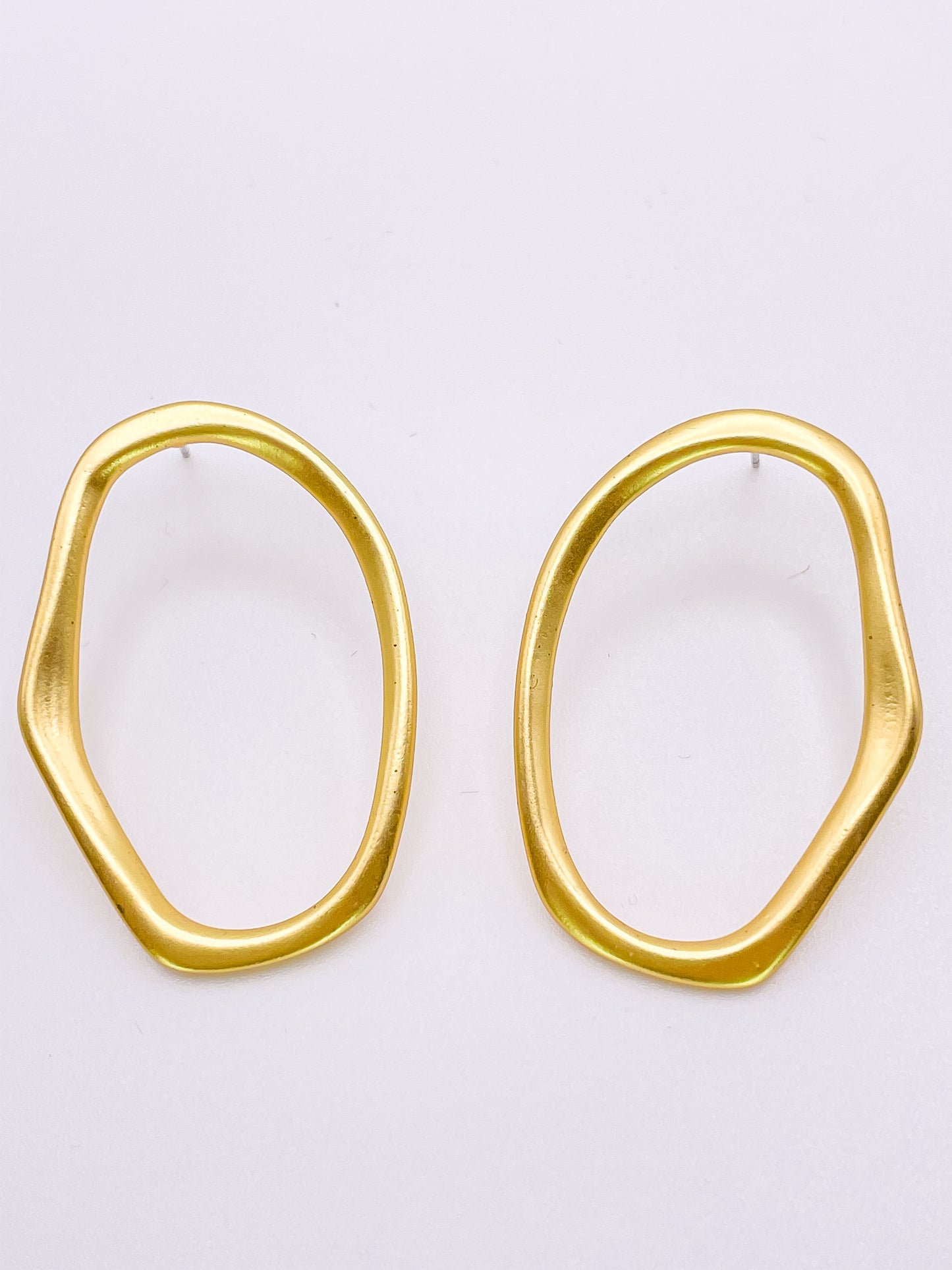 Gold imperfect oval hoops