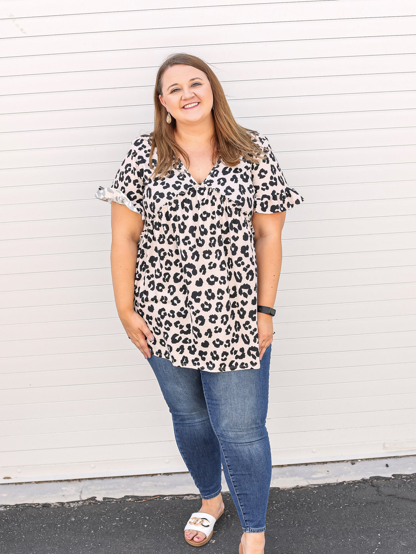 Front view: leopard v-neck top with ruffled details