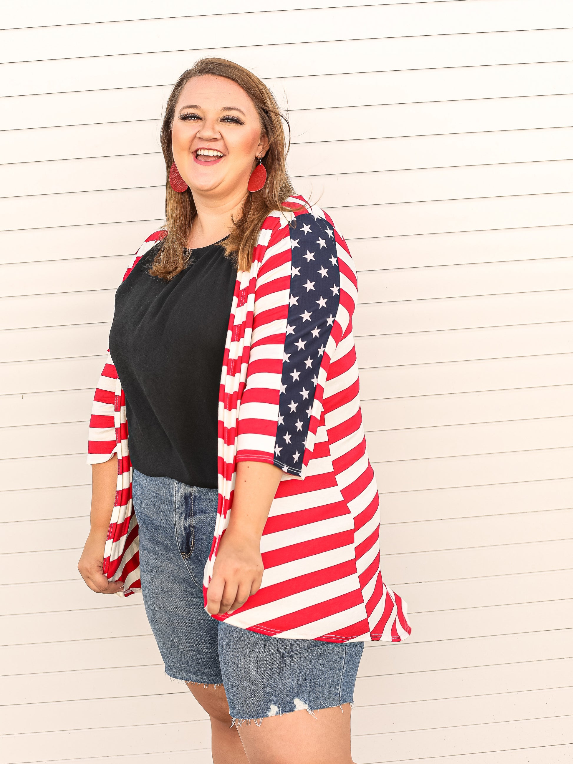Open front cardigan with red and white stripes & blue with white star details down the sleeves. 