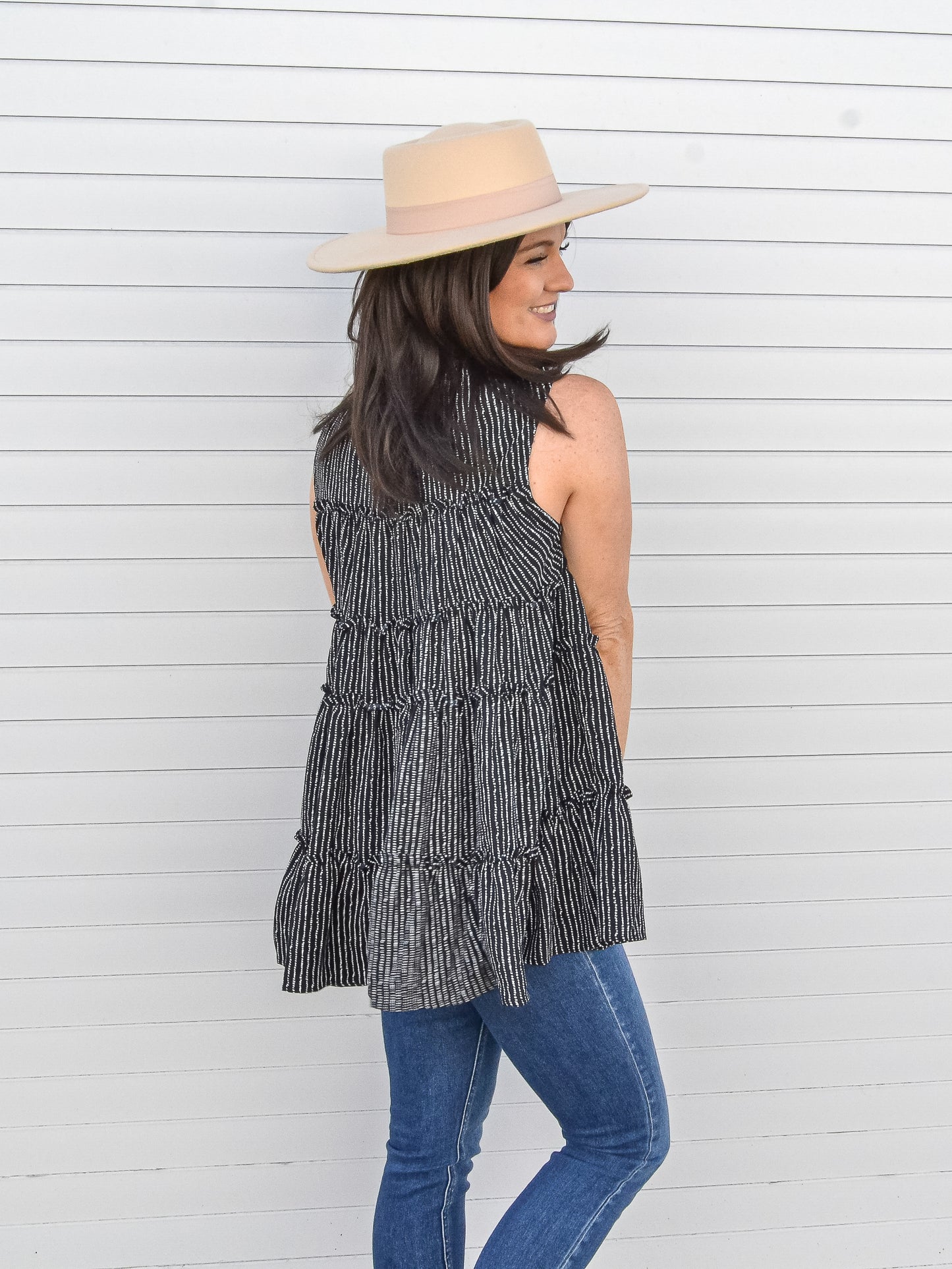 Back view of tiered sleeveless top.