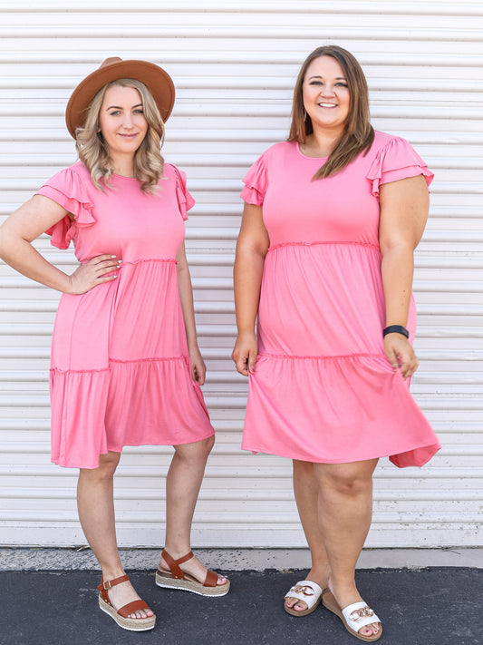 Tacy and Crystal twinning in the pink ruffled short sleeve dress. 