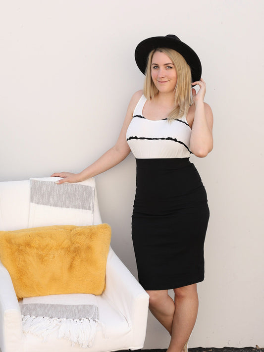 Classic, pull  on black pencil skirt. Styled casually with a tank top