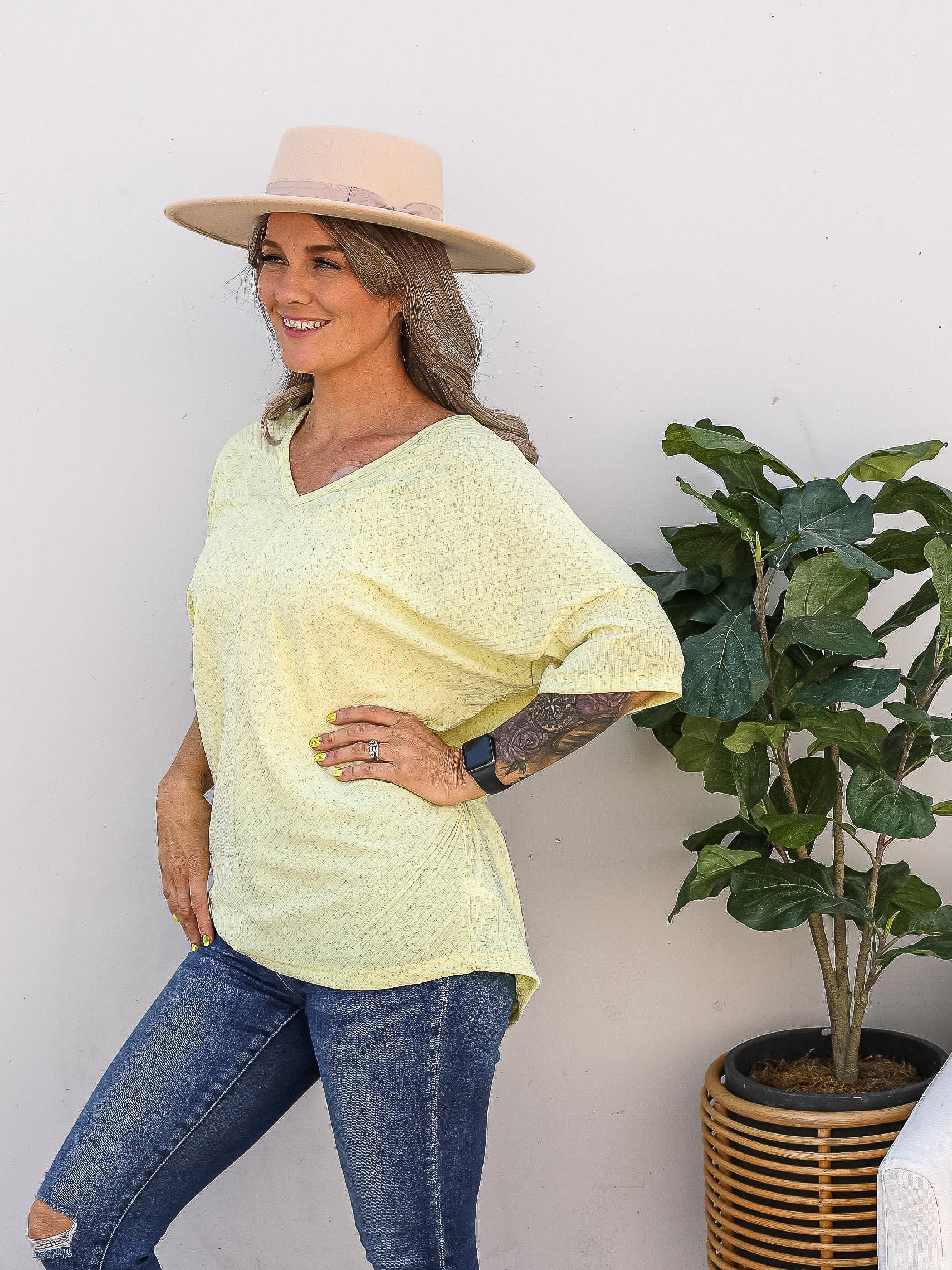 Simple yellow v-neck top with Grey heathering throughout 