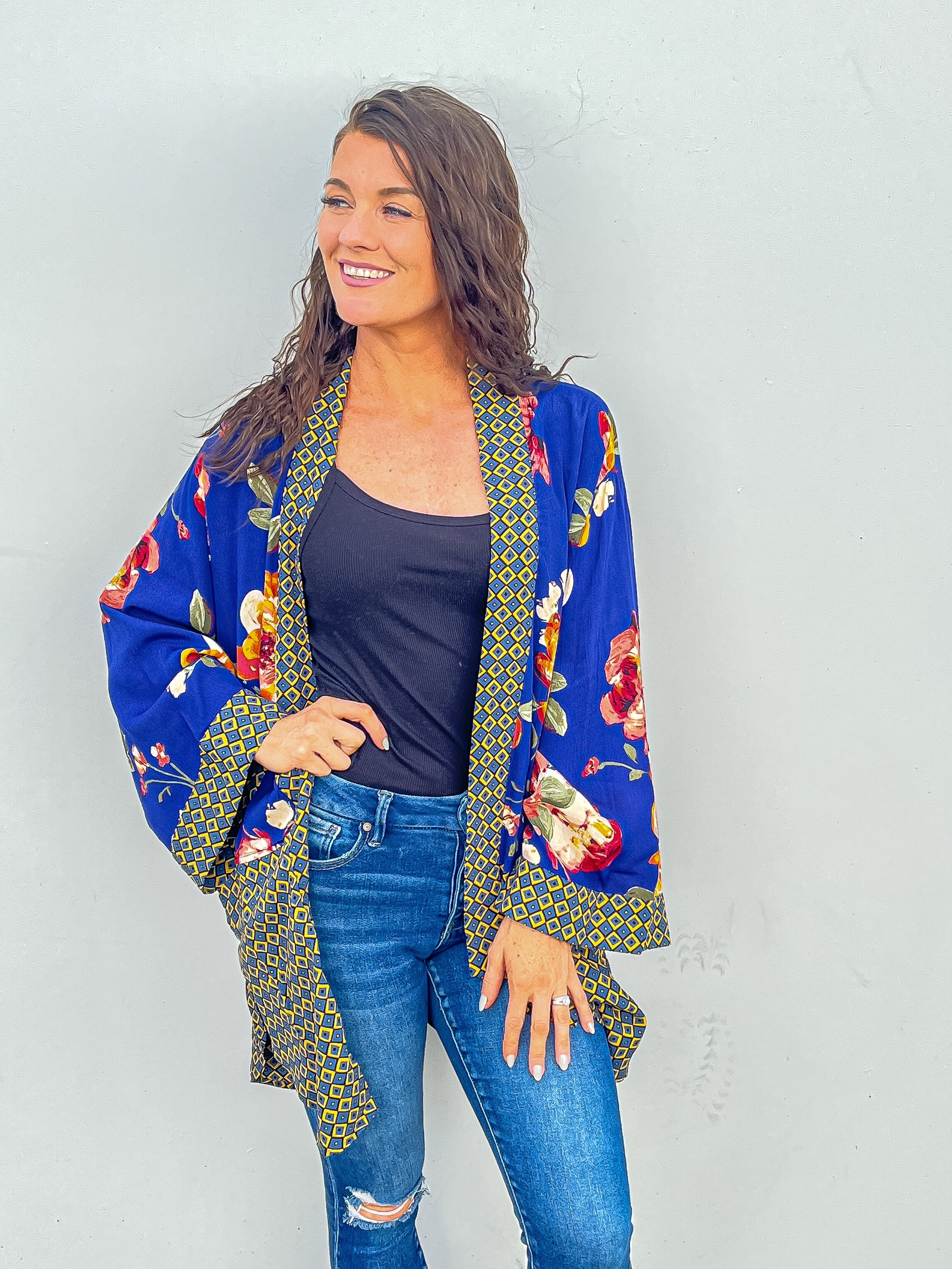 Royal blue colored kimono with floral accents and bell sleeves