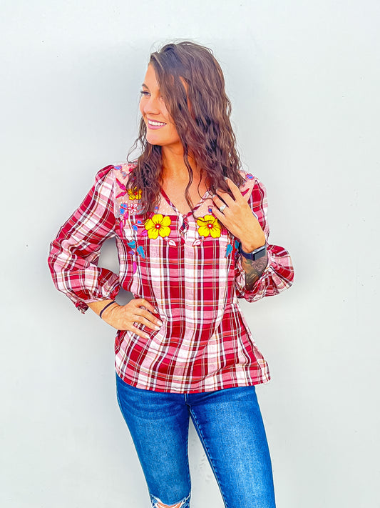 Bight red plaid top styled with distressed denim