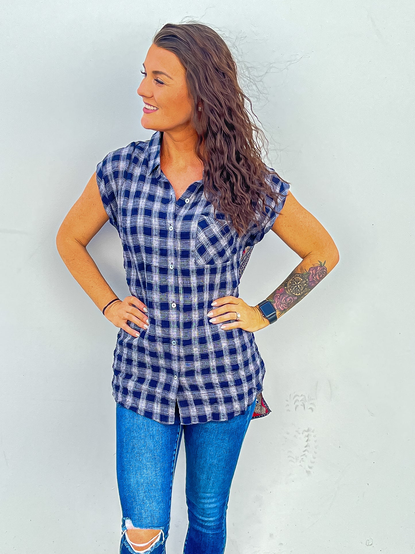 Blue plaid short sleeve top with buttons down the front