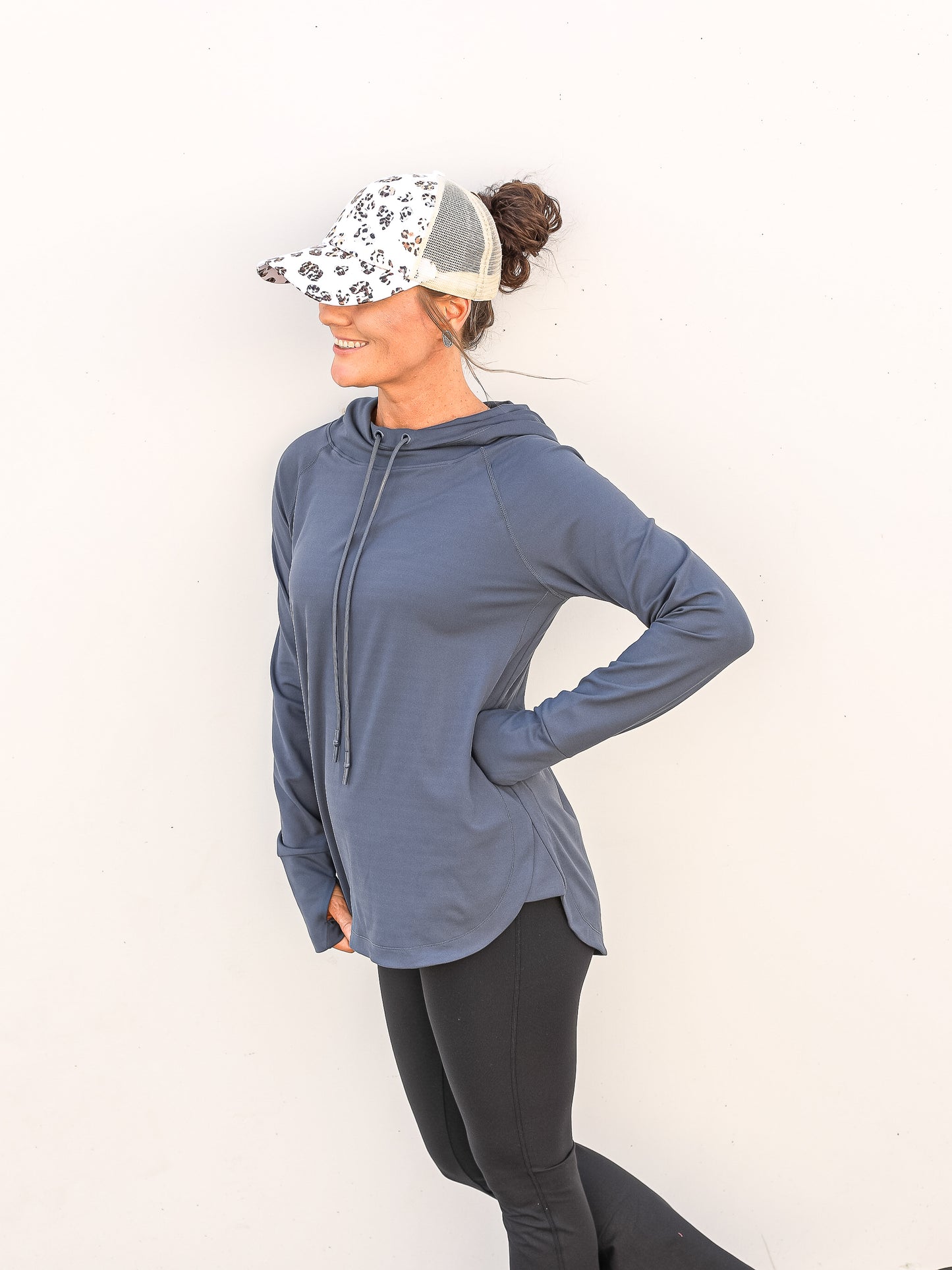 Workout material simple blue hoodie paired with leggings and a cap