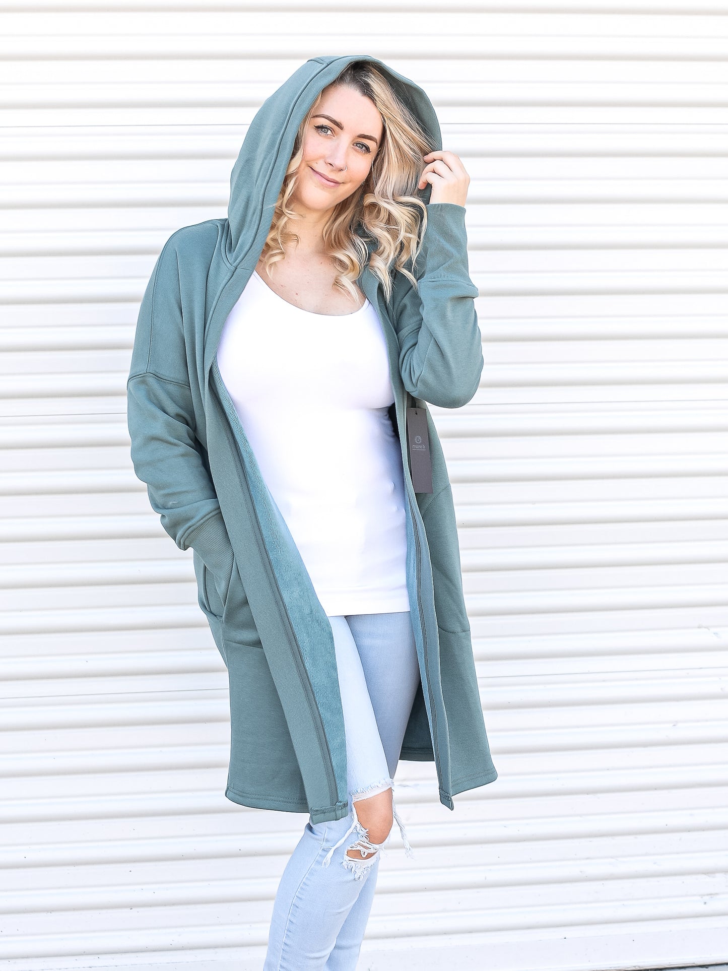 Open front teal colored cardigan with pockets and hood