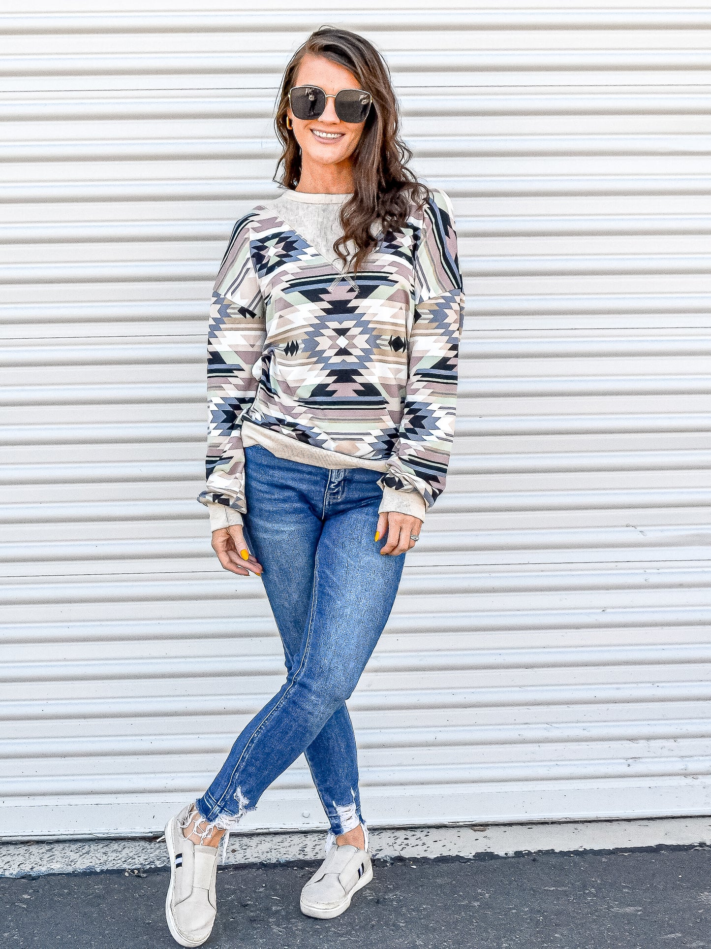 Aztec long sleep top styled casually with jeans and walking shoes