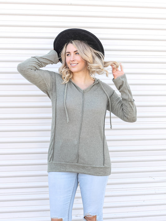Green pullover hoodie with ribbing details