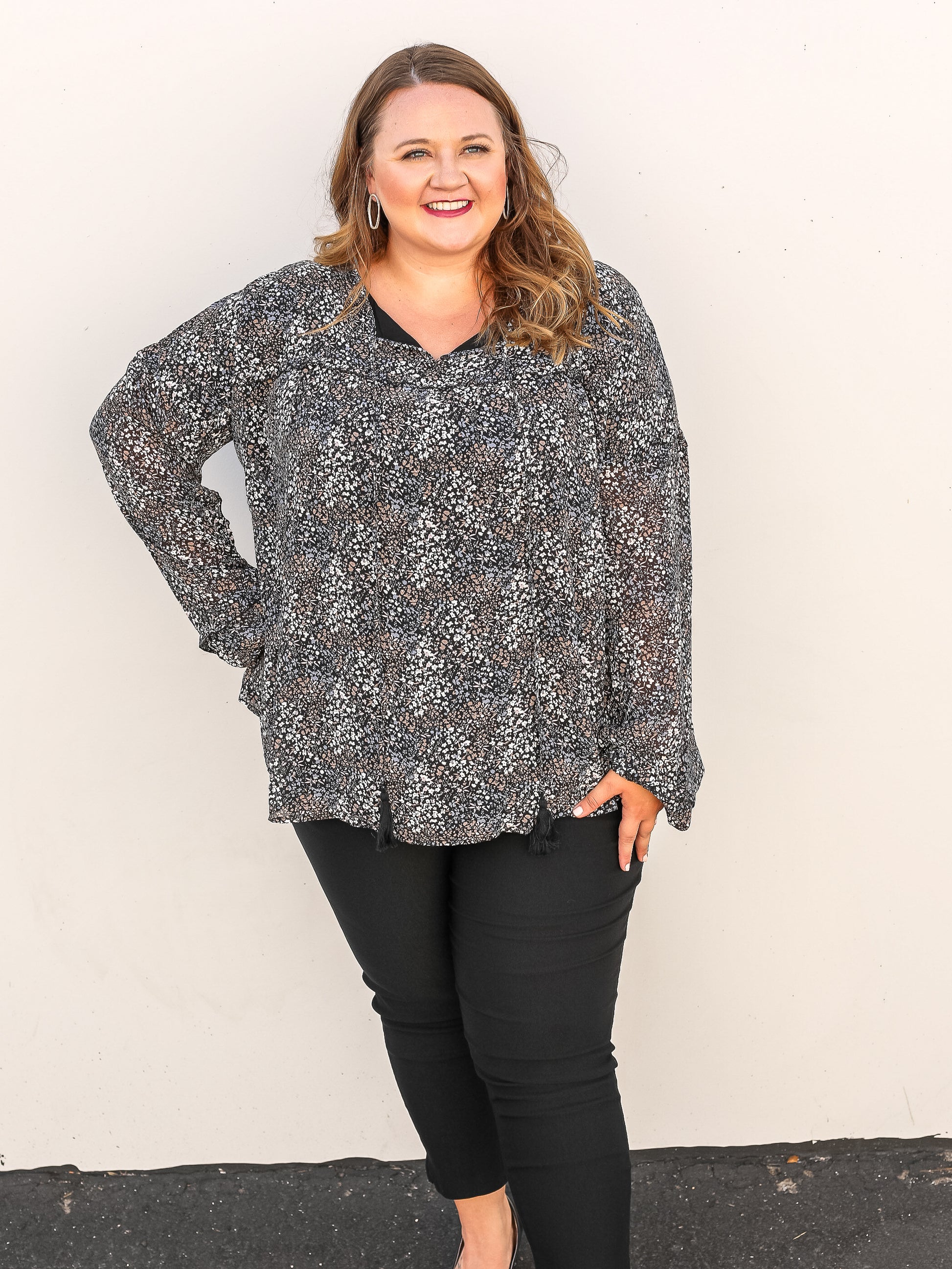 Floral blouse with mini floral patterns pairs great with black slacks and jeans