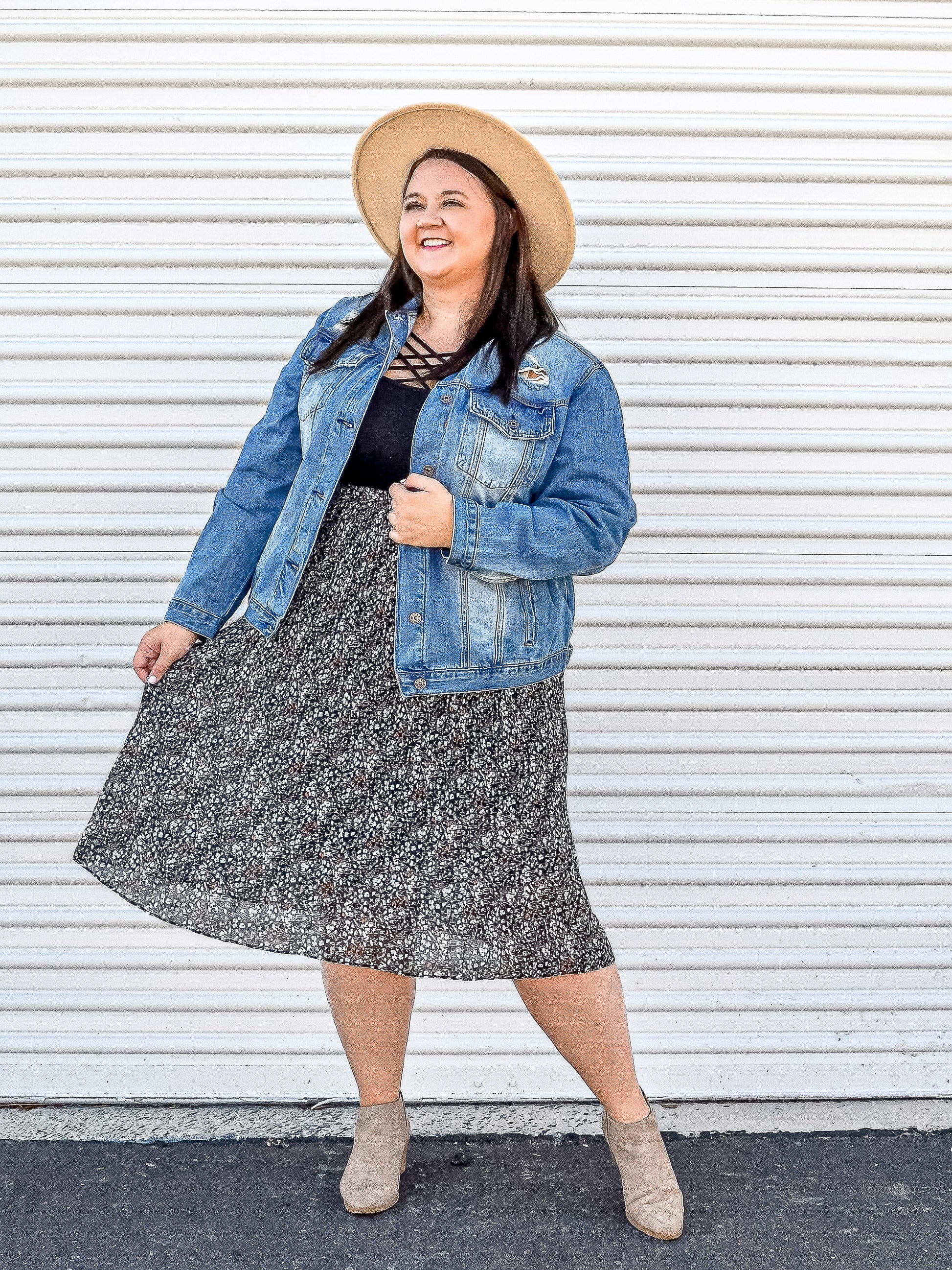 Floral skirt dressed up with a denim jacket and hat