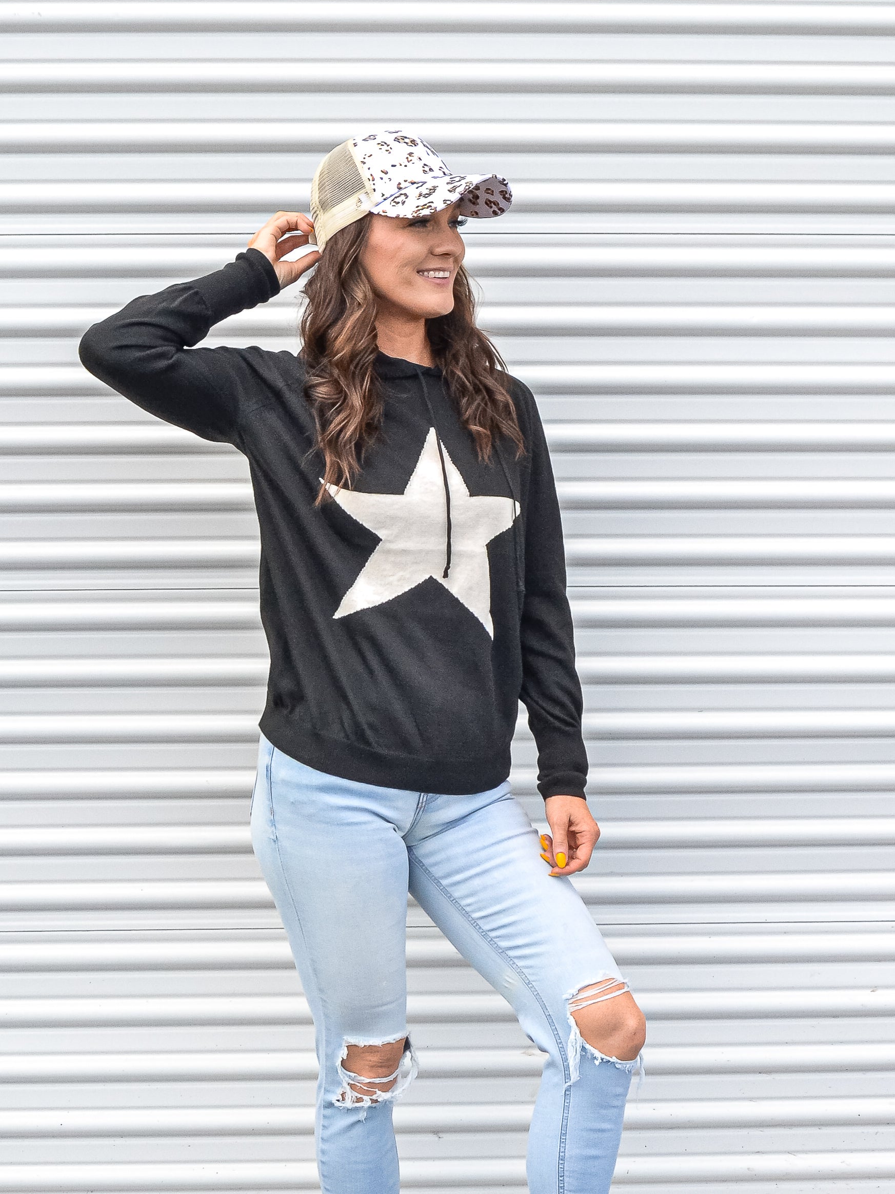 Cozy light weight hoodie with a white star on the front