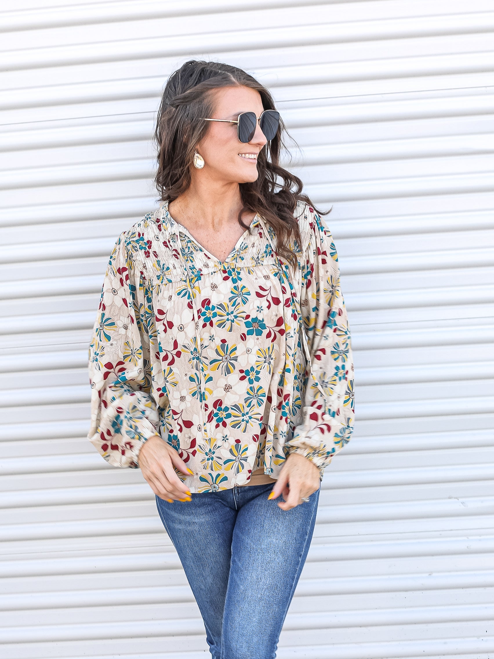 Floral top with 70's vibes paired with jeans