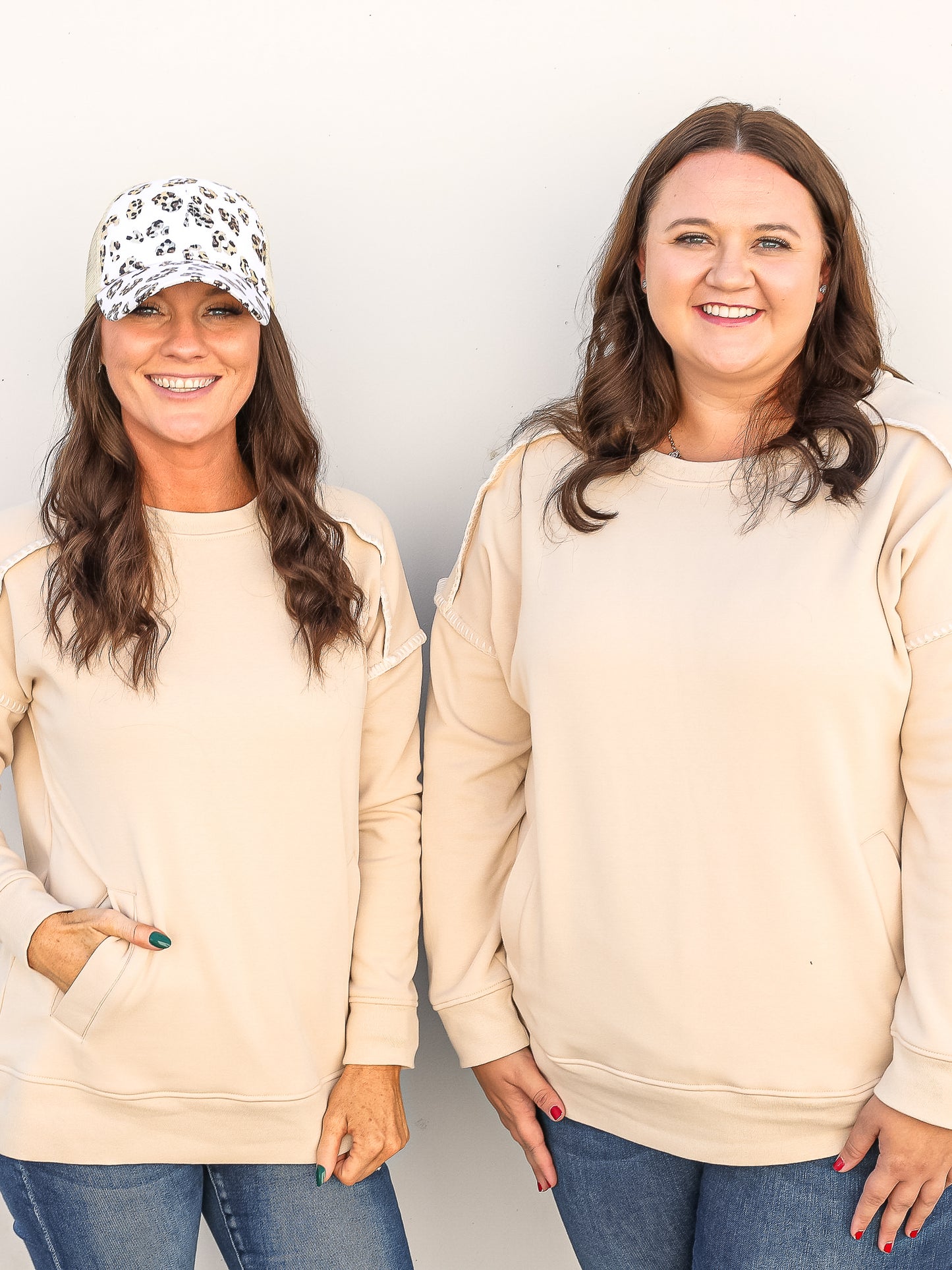 Tiff and Tace twinning in the cream crew neck with reversed stitching 