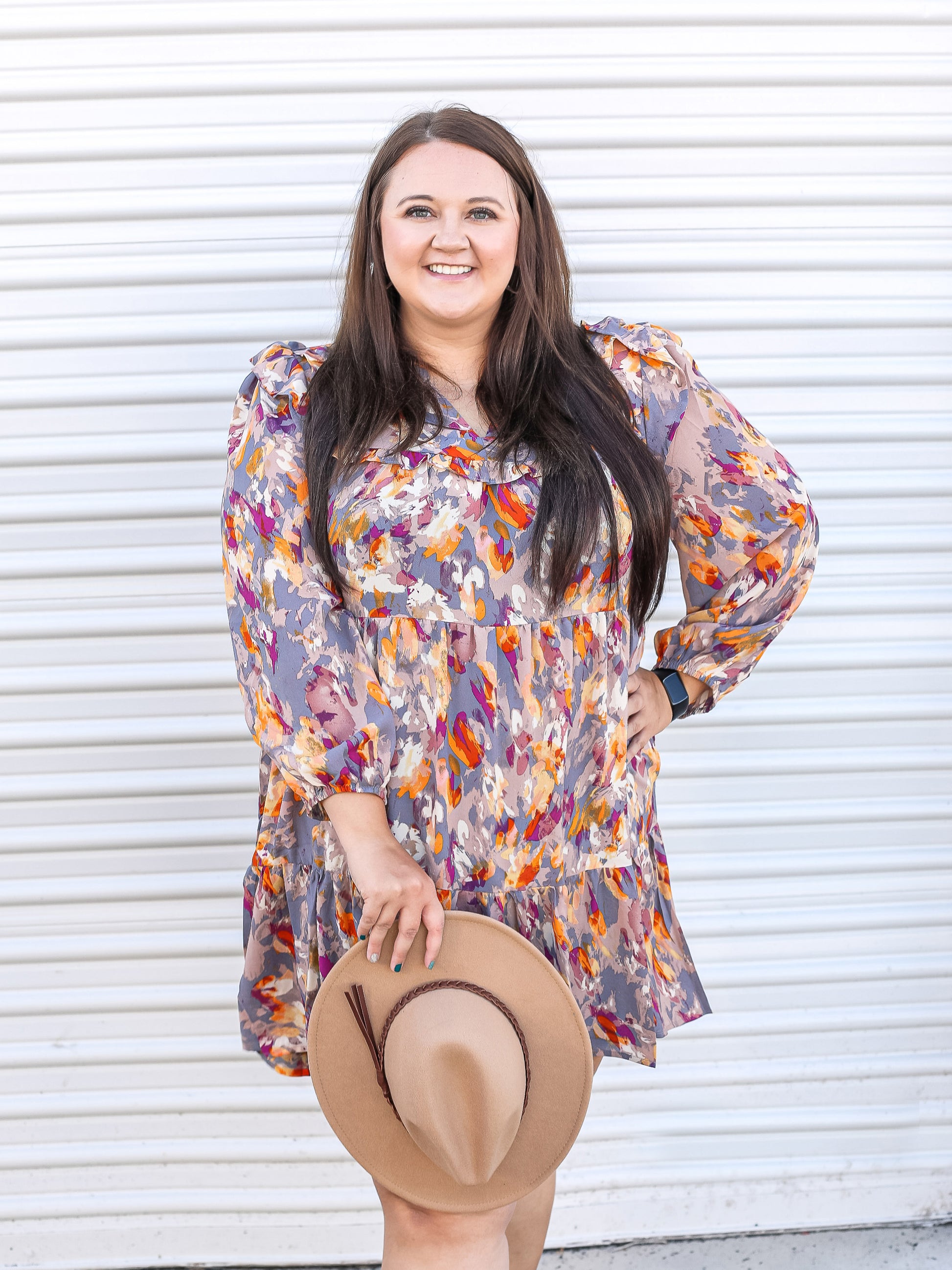 Multicolored dress with bubble sleeves paired with a hat