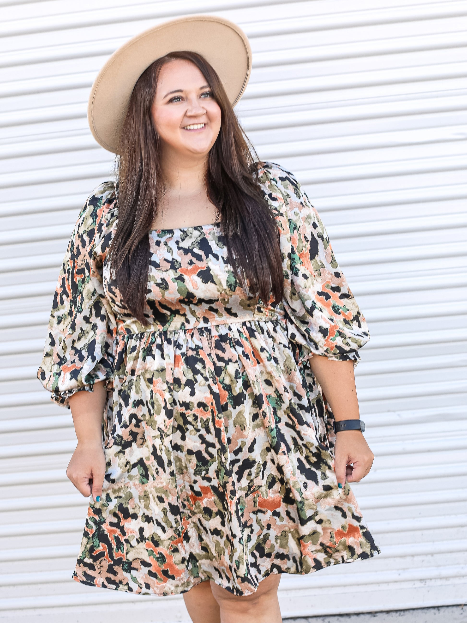 Leopard multicolored dress paired with a wide brimmed hat